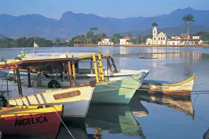 Brazil, Rio de Janeiro, Parati, boats moored in bay, town in background Brazil, Rio de Janeiro, Parati, boats moored in bay, town in background