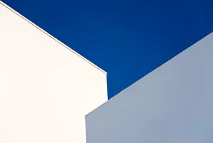 Simplicity in Focus: A Minimal Art Photography Collection: Two Buildings and a Blue Sky