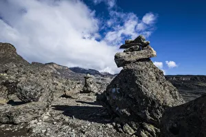 Cairns lead the way through harsh alpine zone landscape around Moir Huts campsite Cairns lead the way through harsh alpine zone landscape around Moir Huts campsite