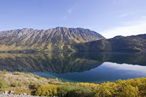 Calm windy arm of Tagish Lake, reflections, Escarment Mountain, Tagish Highland behind, autumn, Indian Summer Calm windy arm of Tagish Lake, reflections, Escarment Mountain, Tagish Highland behind, autumn, Indian Summer