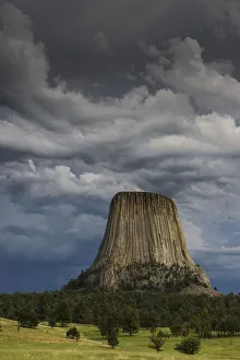 Columnar basalt formation and approaching thunderstorm, Devils Tower National Monument, Wyoming, USA Columnar basalt formation and approaching thunderstorm, Devils Tower National Monument, Wyoming, USA