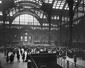 Commuters crowd the terminal of Pennsylvania Station, preparing to leave town for Commuters crowd the terminal of Pennsylvania Station, preparing to leave town for