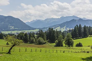 Cultural landscape at Buching, behind the Ammergau Alps, Halblech, Allgau, Bavaria, Germany Cultural landscape at Buching, behind the Ammergau Alps, Halblech, Allgau, Bavaria, Germany
