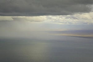 Cumulus clouds and rain showers over sea, aerial view Cumulus clouds and rain showers over sea, aerial view