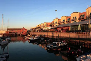 Dawn, boats and houses in Brighton Marina Dawn, boats and houses in Brighton Marina
