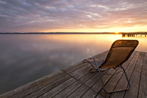 Deckchair on a jetty, early morning at Lake Starnberg near Seeshaupt, Bavaria, Germany, Europe, PublicGround Deckchair on a jetty, early morning at Lake Starnberg near Seeshaupt, Bavaria, Germany, Europe, PublicGround