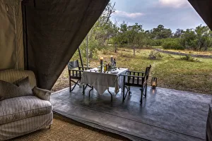 Dining outside of luxury tent, Machaba Camp, Okavango Delta, Botswana Dining outside of luxury tent, Machaba Camp, Okavango Delta, Botswana