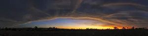 Dramatic Panoramic Sunset Landscape with the cloud formation forming a big eye in the sky Dramatic Panoramic Sunset Landscape with the cloud formation forming a big eye in the sky