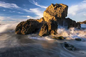 Dramatic seascape of Waves Crashing over Rocks on the beach at Kenton-On-Sea, Eastern Cape Province, South Africa Dramatic seascape of Waves Crashing over Rocks on the beach at Kenton-On-Sea, Eastern Cape Province, South Africa