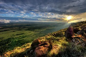 Dramatic Sunset from the edge of a cliff over the Magaliesberg Mountain Range looking Dramatic Sunset from the edge of a cliff over the Magaliesberg Mountain Range looking