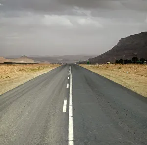 Dual Tar Road Going Through Arid Area on an Overcast Day Dual Tar Road Going Through Arid Area on an Overcast Day
