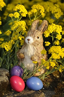 Easter bunny figure with brightly coloured Easter eggs Easter bunny figure with brightly coloured Easter eggs