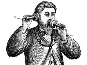 Engraving Alexander Graham Bell making a call on antique telephone Engraving Alexander Graham Bell making a call on antique telephone