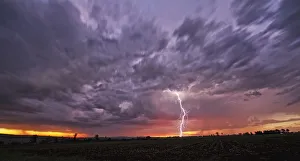 A Fast Moving African Thunderstorm with a Forked Lightning Strike at Sunset, Magaliesburg, Gauteng Province A Fast Moving African Thunderstorm with a Forked Lightning Strike at Sunset, Magaliesburg, Gauteng Province