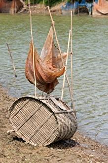 Fish trap made of bamboo and a fishing net on the Sangkae river, Battambang, Cambodia, Southeast Asia Fish trap made of bamboo and a fishing net on the Sangkae river, Battambang, Cambodia, Southeast Asia