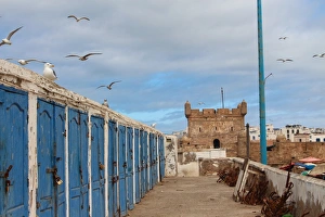 Fishermens huts and Genoese-built citadel in Essaouira harbour, on Atlantic coast of Morocco Fishermens huts and Genoese-built citadel in Essaouira harbour, on Atlantic coast of Morocco