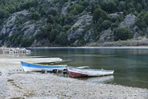 Fishing boats on the shore of Lago Bertrand at the mouth of Baker River, Bertrand, Aysen, Chile Fishing boats on the shore of Lago Bertrand at the mouth of Baker River, Bertrand, Aysen, Chile