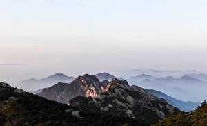Fog rolling over Mount Huangshan (Yellow Mountain or Mt. Huangshan), Anhui Province, China Fog rolling over Mount Huangshan (Yellow Mountain or Mt. Huangshan), Anhui Province, China