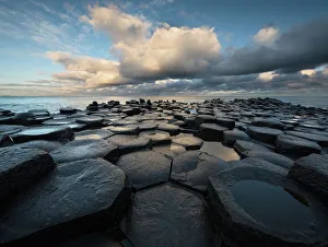Giants Causeway basalt columns with Atlantic Ocean in the distance Giants Causeway basalt columns with Atlantic Ocean in the distance
