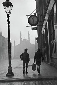 Black & White Prints: Gorbals area of Glasgow; Two young boys walking along a street in 1948