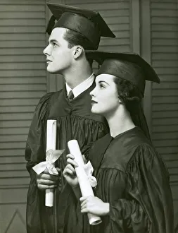 Graduates with diplomas