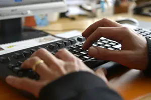 Images Dated 6th June 2013: Hands typing on a computer keyboard Print