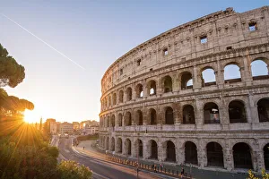 High angle view over the Colosseum at sunrise. Rome, Lazio, Italy High angle view over the Colosseum at sunrise. Rome, Lazio, Italy