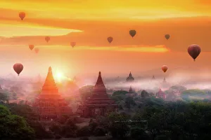 Hot air balloon over plain of Bagan in misty morning, Mandalay, Myanmar Hot air balloon over plain of Bagan in misty morning, Mandalay, Myanmar