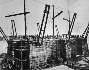 Prints of A crowd stands on the early foundations of the Brooklyn Bridge in New York, 21st September 1872. (Photo by Hulton Archive/Getty Images) World Famous Bridges Prints: Brooklyn Bridge Foundations Print