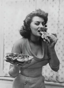 Prints of Italian actress Sophia Loren eating pizza, 1954. (Photo by Archive Photos/Getty Images) Actors And Actress Prints: Sophia Loren Eating Pizza Print, 1954