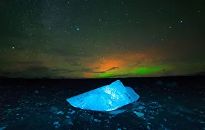 Iceberg under Aurora borealis at Jokulsarlon, Iceland Iceberg under Aurora borealis at Jokulsarlon, Iceland