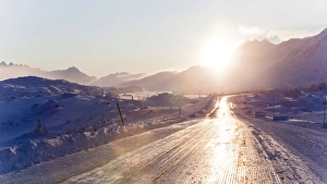 Icy road reflecting sunlight, Coastal Range, South Klondike Highway, White Pass, connecting Skagway, Alaska Icy road reflecting sunlight, Coastal Range, South Klondike Highway, White Pass, connecting Skagway, Alaska