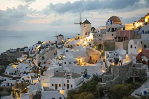 Illuminated Oia village at dusk, Santorini, Greece Illuminated Oia village at dusk, Santorini, Greece