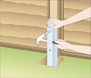 Illustration of using claw hammer to mark fixing holes in fence spur and wood post Illustration of using claw hammer to mark fixing holes in fence spur and wood post