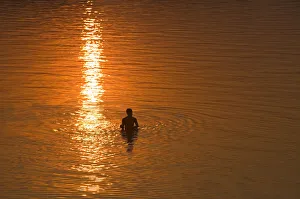 India, Goa, swimmer silhouetted in water, elevated veiw India, Goa, swimmer silhouetted in water, elevated veiw