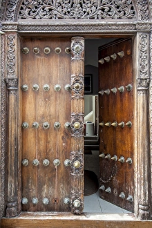 Intricately carved wooden Arab door in Stone Town Intricately carved wooden Arab door in Stone Town