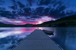 Ladybower Reservoir jetty at sunset. English Peak District Ladybower Reservoir jetty at sunset. English Peak District