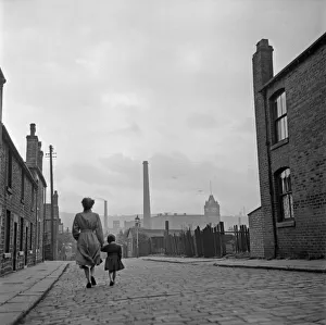 Lancashire Mill Town; Cotton mill worker Alice Nelson sets out for work at the Lilac Mill in Shaw Lancashire Mill Town; Cotton mill worker Alice Nelson sets out for work at the Lilac Mill in Shaw