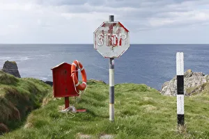 Life ring and stop sign, Three Castle Head, Mizen Head Peninsula, West Cork, Republic of Ireland, British Isles, Europe Life ring and stop sign, Three Castle Head, Mizen Head Peninsula, West Cork, Republic of Ireland, British Isles, Europe