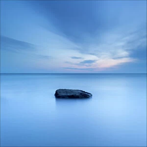 Simplicity in Focus: A Minimal Art Photography Collection: Lone rock in sea