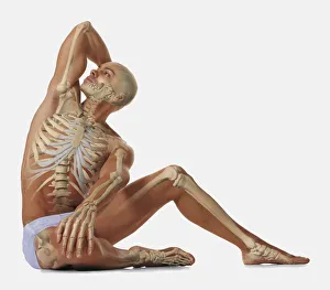 Man sitting on floor with one hand behind head, other hand on his knee, looking up Man sitting on floor with one hand behind head, other hand on his knee, looking up