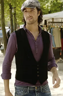 Man wearing casual clothes at a flea market during a city tour Man wearing casual clothes at a flea market during a city tour