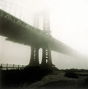 Manhattan bridge in mist in New York City, NY Manhattan bridge in mist in New York City, NY