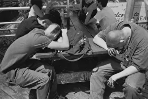 Men sleeping on picnic table Men sleeping on picnic table