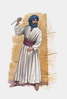 Middle eastern man standing near wall holding knife Middle eastern man standing near wall holding knife