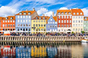 Multicolored houses along the canal in Nyhavn harbor, Copenhagen, Denmark