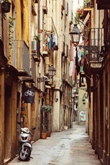 Narrow winding street in Barrio Gotico, Barcelona Narrow winding street in Barrio Gotico, Barcelona