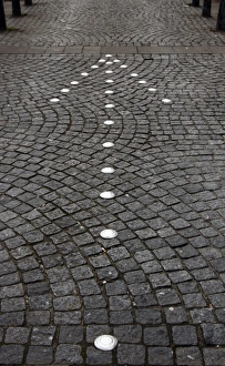 Old directional arrow sign on cobblestone street, Hamburg, Germany, Europe Old directional arrow sign on cobblestone street, Hamburg, Germany, Europe