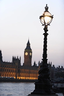 Old-Fashioned Street Lamp With Houses Of Parliament Illuminated In The Background, London Old-Fashioned Street Lamp With Houses Of Parliament Illuminated In The Background, London