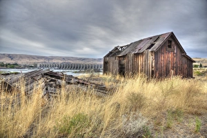 An old fish shack on a riverbank An old fish shack on a riverbank